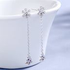 Women’s earrings with sparkling snowflake pendant and chain embellishment Fashion Glam