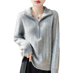 Women's wool sweater with cable pattern and half zipper