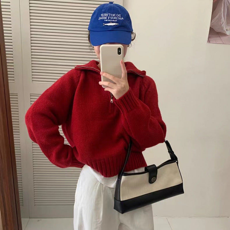Modern knit pullover with stand-up collar and zipper
