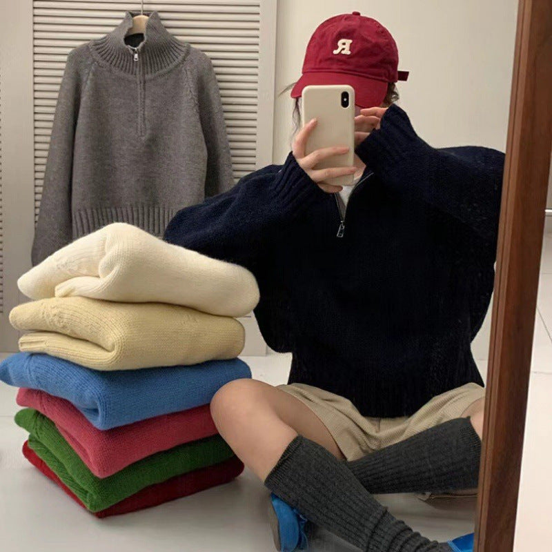 Modern knit pullover with stand-up collar and zipper