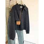 Women's knit sweater with polo collar and zipper