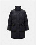 Women's long thermal quilted coat in oversized fit with rounded hem, college logo, and large flap pockets