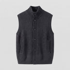 Women's sleeveless structured knit vest with high ribbed collar, concealed button placket and inset pockets Fashion Glam