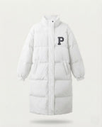 Women's longer boxy thermo puffer with high stand-up collar, college patch, and noise-reducing outer shell