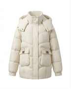 Women's mid-length padded parka with high stand-up collar flap, stowable hood, and large cargo pockets