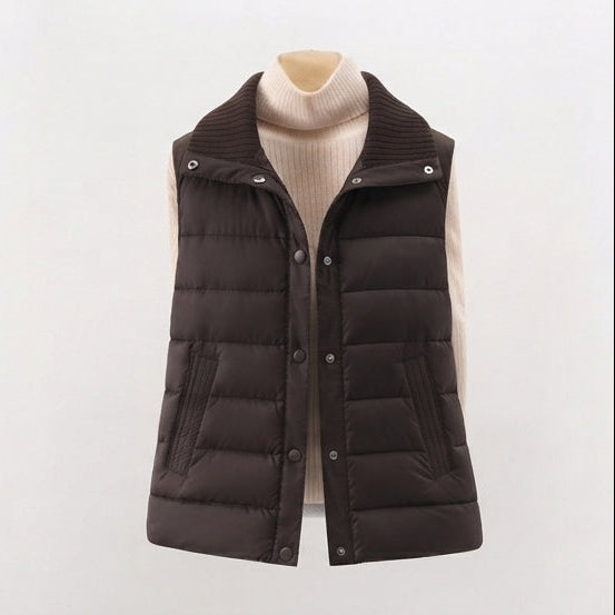 Women's non-padded quilted gilet with high ribbed shawl collar and concealed snap button placket