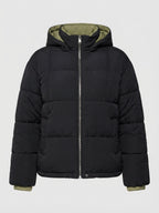 Women's short padded city puffer jacket with contrasting inner trim, hood, and insulating climate padding