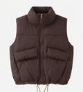 Women's short padded quilted vest with high stand-up collar, two patch flap pockets and adjustable drawstring hem