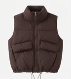 Women's short padded quilted vest with high stand-up collar, two patch flap pockets and adjustable drawstring hem