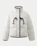 Women's short quilted puffer jacket with high standing collar, textured structure, and decorative drawstrings