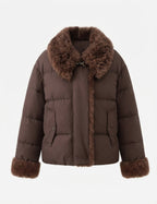 Women's short quilted jacket with voluminous faux fur collar, teddy trim on sleeves and concealed button placket
