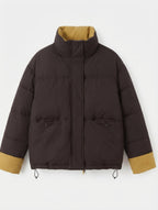 Women's short padded boxy jacket with stand-up collar and concealed button placket