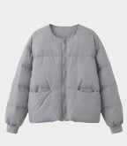 Women's short boxy quilted jacket with straight cut, concealed zipper, and elastic cuffs