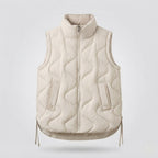 Women's sleeveless microfiber insulation vest with wavy quilting and adjustable drawstring hem