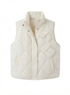 Women's quilted thermal vest with high collar, decorative flap pockets, and adjustable hem