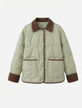 Women's short quilted cord collar jacket with snap button placket and contrast piping