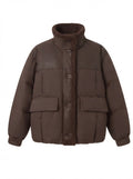Women's short quilted bomber jacket with teddy lining, faux leather front panels, and patch pockets