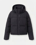 Women's compact quilted jacket with extra voluminous hood and concealed snap button placket