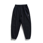 Unisex wide jogging pants in oversized cut with elastic waistband, knee panel and ribbed cuffs Fashion Glam