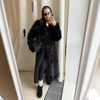 Women's elegant long pile faux fur coat with hood and tailored silhouette Fashion Glam