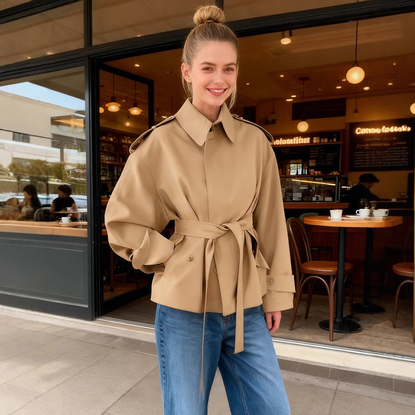 Women's short trench coat with waist belt, shoulder flaps, and patch pockets Fashion Glam