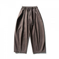 Unisex wide balloon pants made of cotton blend with drawstring waistband and decorative darts Fashion Glam