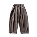 Unisex wide balloon pants made of cotton blend with drawstring waistband and decorative darts Fashion Glam