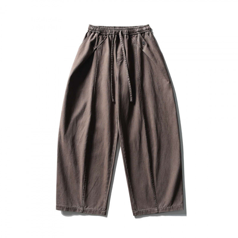 Unisex wide balloon pants made of cotton blend with drawstring waistband and decorative darts Fashion Glam