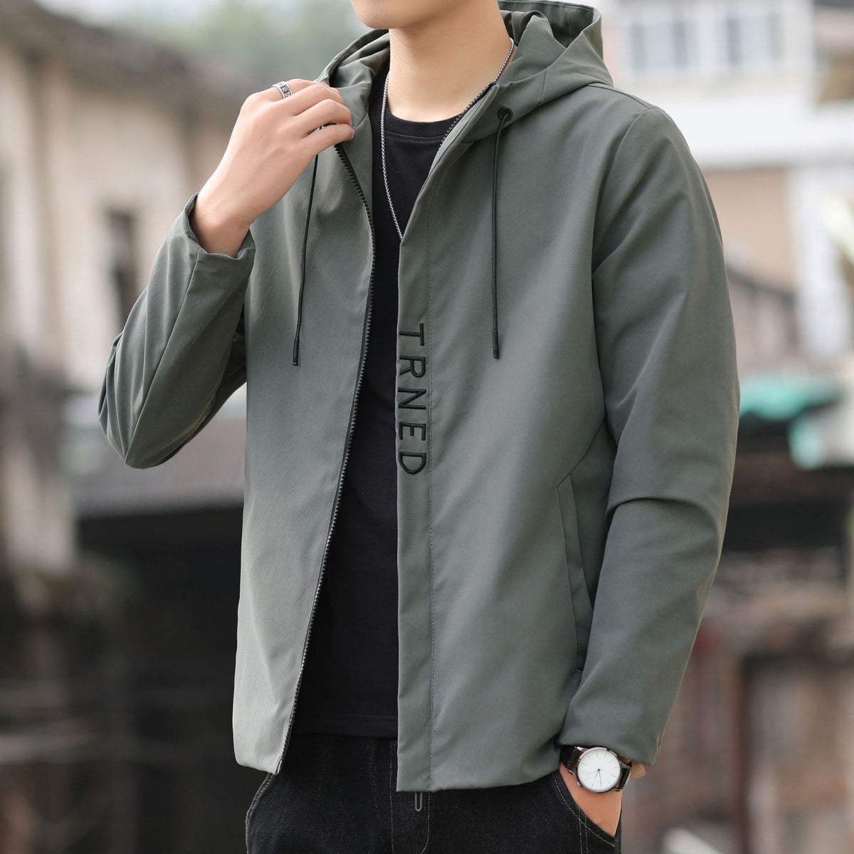 Men's lightweight hooded shell jacket with concealed zipper and minimalist utility look Fashion Glam