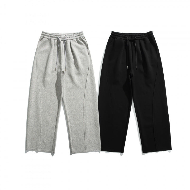Unisex Loose Cotton Fleece Jogging Pants with Drawstring, Decorative Front Seams and Raw Hem Fashion Glam