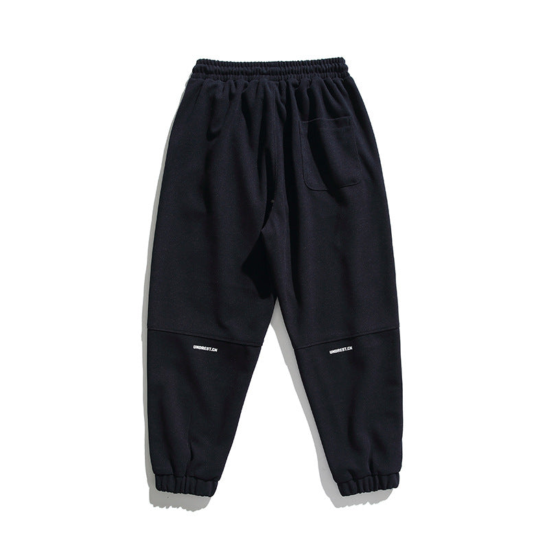 Unisex wide jogging pants in oversized cut with elastic waistband, knee panel and ribbed cuffs Fashion Glam
