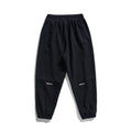 Unisex wide jogging pants in oversized cut with elastic waistband, knee panel and ribbed cuffs Fashion Glam