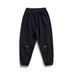 Unisex wide jogging pants in oversized cut with elastic waistband, knee panel and ribbed cuffs Fashion Glam