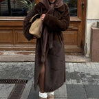 Women's elegant long pile faux fur coat with hood and tailored silhouette Fashion Glam