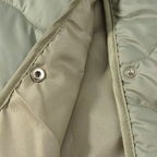 Women's oversized quilted jacket in cocoon cut with wave-shaped quilting and round neckline Fashion Glam
