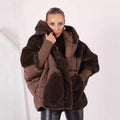Women's short quilted jacket in cocoon cut with voluminous faux fur trim and hood Fashion Glam