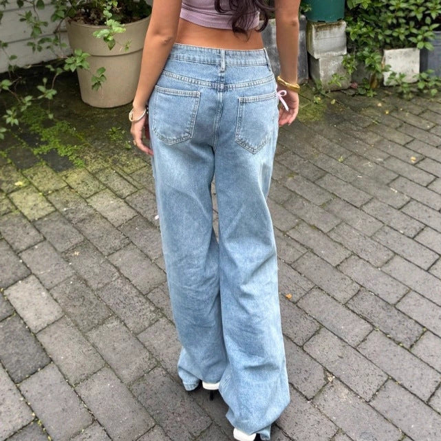 Women High-Waist Baggy Jeans with Vintage Wash, Rips and Pink Bow Applications Fashion Glam