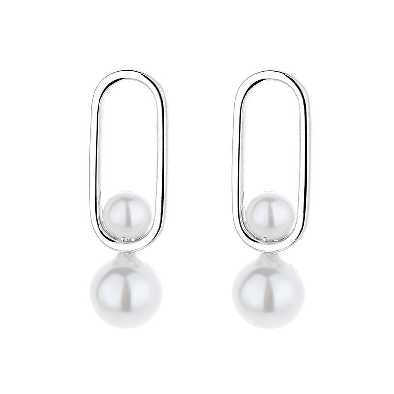Women's stud earrings with modern oval design and elegant pearls Fashion Glam