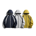 [Unisex Lightweight windproof hooded jacket in sporty utility style with contrast piping and drawstring hem Fashion Glam]