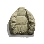 Unisex Oversized padded quilted jacket with high stand collar, large flap pockets and crinkle effect Fashion Glam