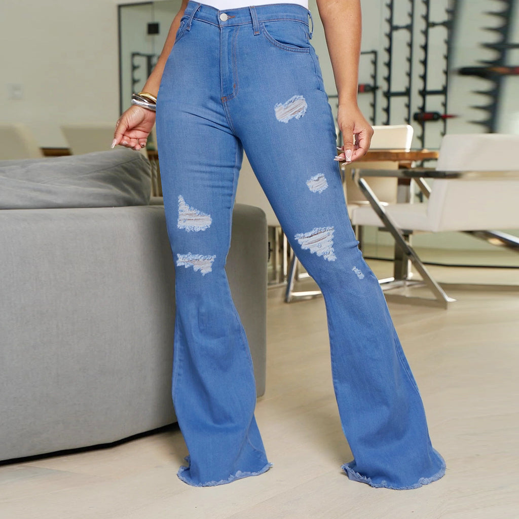 Ladies' waist-fitting flared jeans with ripped inserts and raw hem Fashion Glam