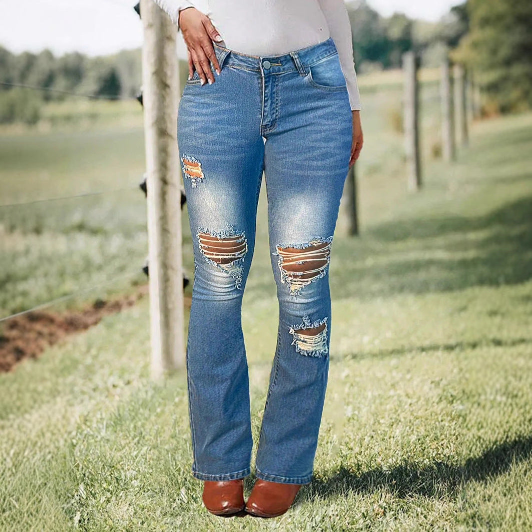 Women's waist-accentuated stretch denim jeans with flared leg and prominent knee rips Fashion Glam