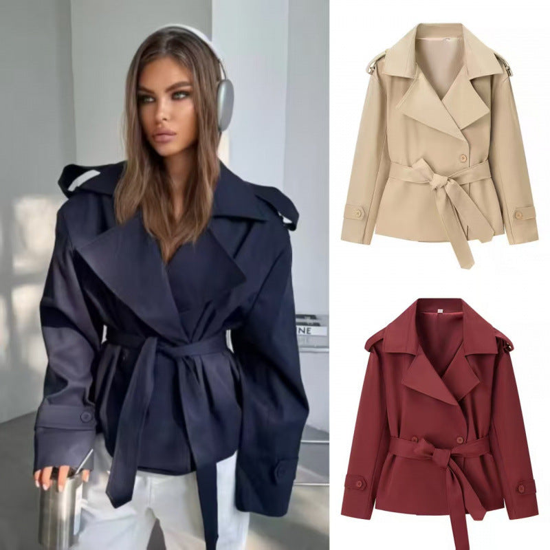 Women's short trench coat with double-breasted button placket, waist belt, and shoulder straps Fashion Glam