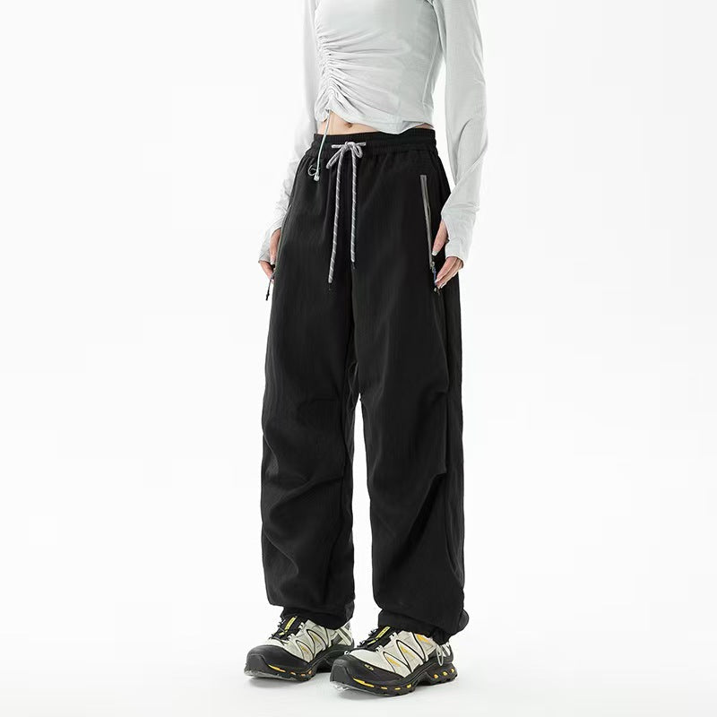 Loose trekking pants with water-repellent quick-drying coating, elastic drawstring waist, and zippered pockets Fashion Glam