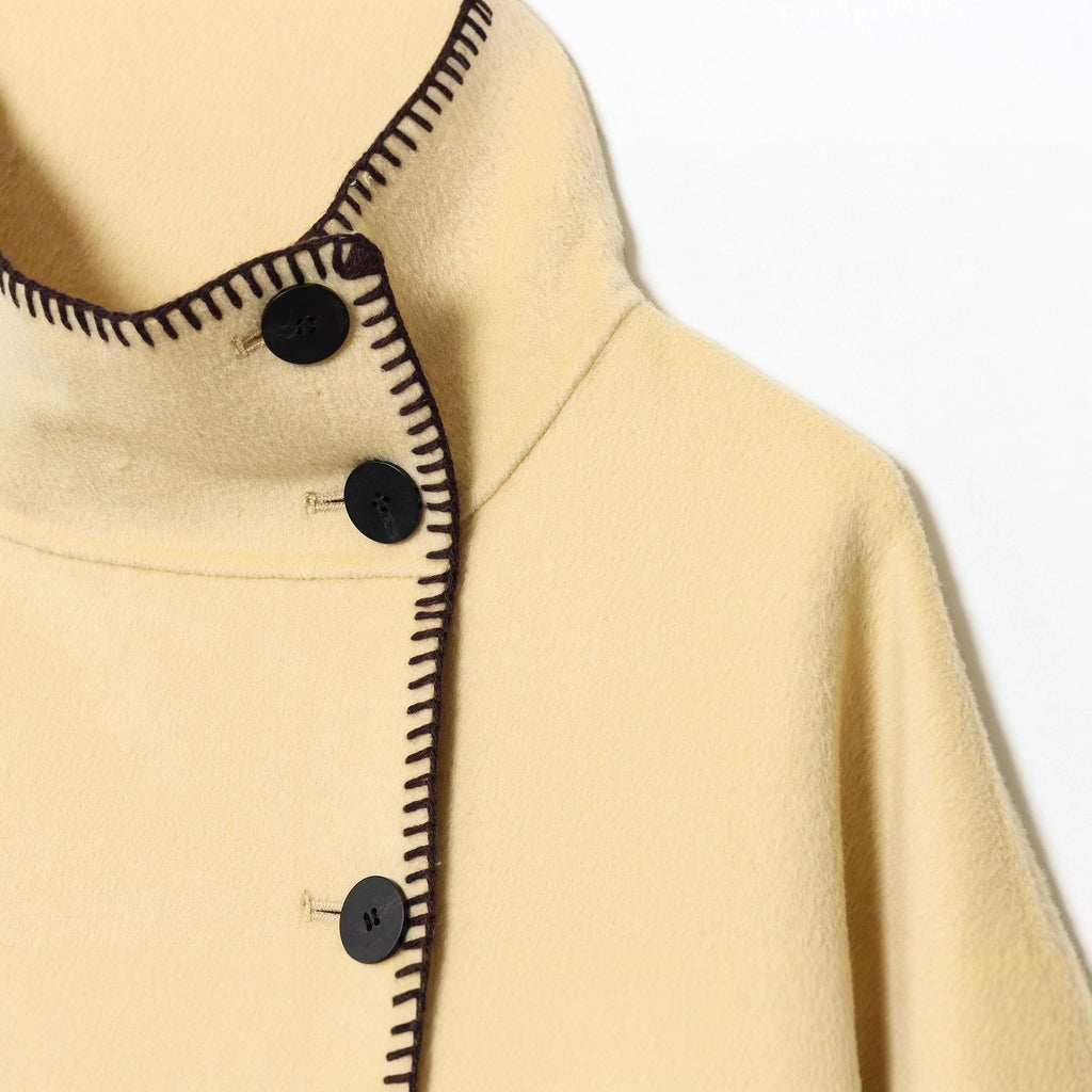 Women's cape coat with stand-up collar, asymmetric button placket and decorative seam Fashion Glam