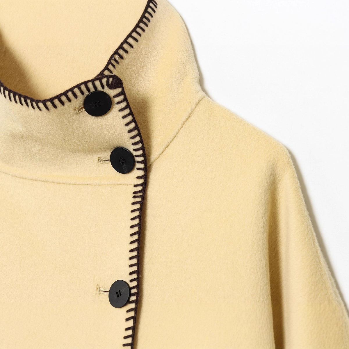 Women's cape coat with stand-up collar, asymmetric button placket and decorative seam Fashion Glam