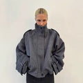 Women's short jacket made of wool blend with high stand-up collar, balloon sleeves and shoulder flaps Fashion Glam