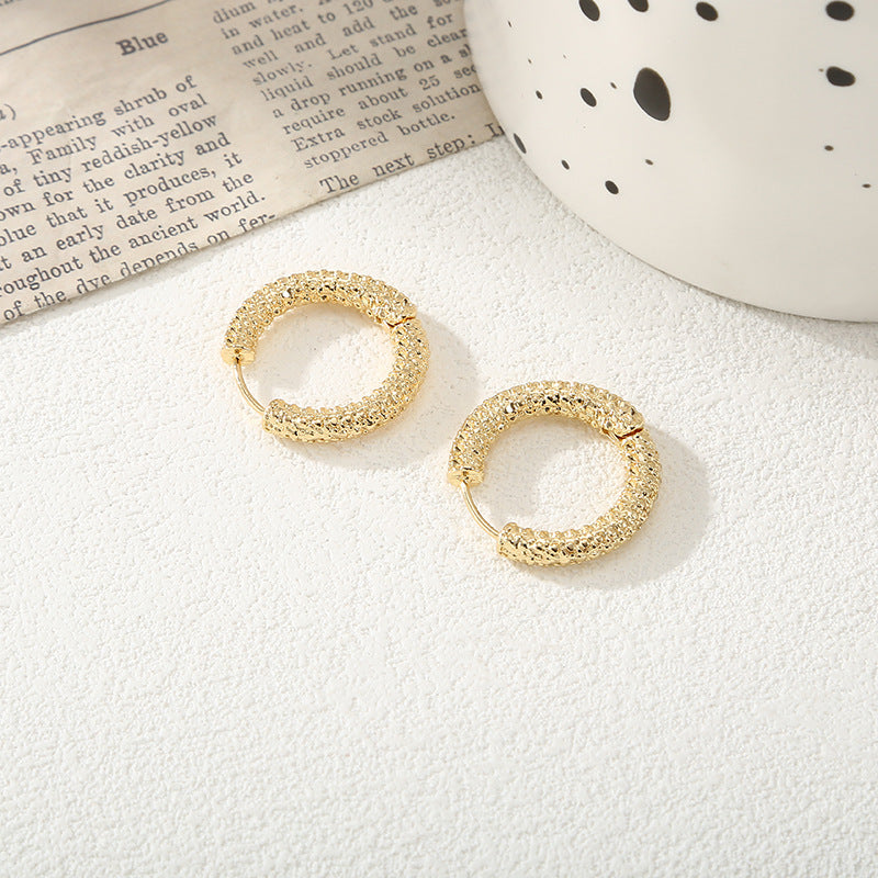 Women's hoop earrings with modern, textured design Fashion Glam