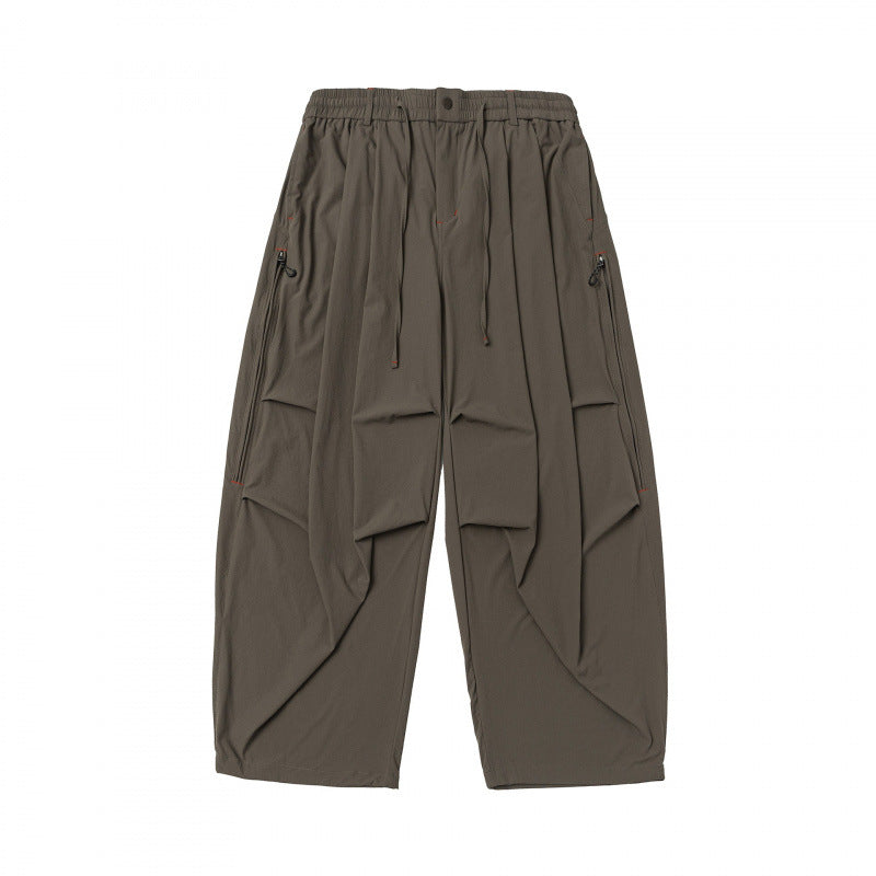 Unisex Loose-fitting technical cargo pants with elastic waistband, drawstring, and zip pockets Fashion Glam