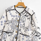 Women's Quilted Short Jacket with Paisley Flower Print, Round Neckline and Contrast Piping Fashion Glam